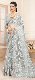 Should I choose heavy or simple net saree?